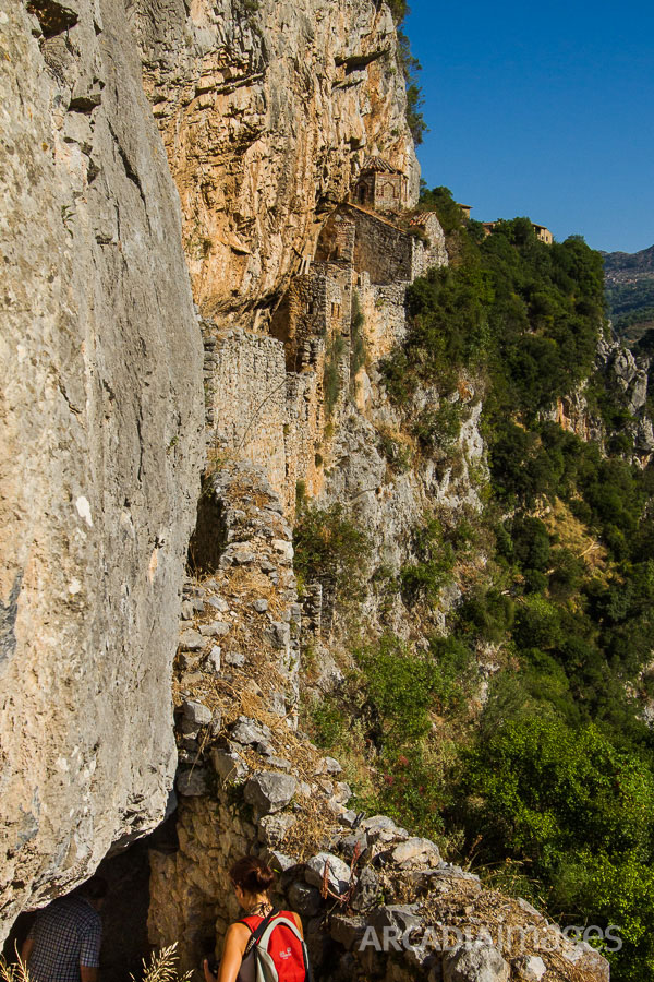 Exploring the ruins of Philosophou monastery, 10th century AD. Lousios gorge, Arcadia, Peloponnese