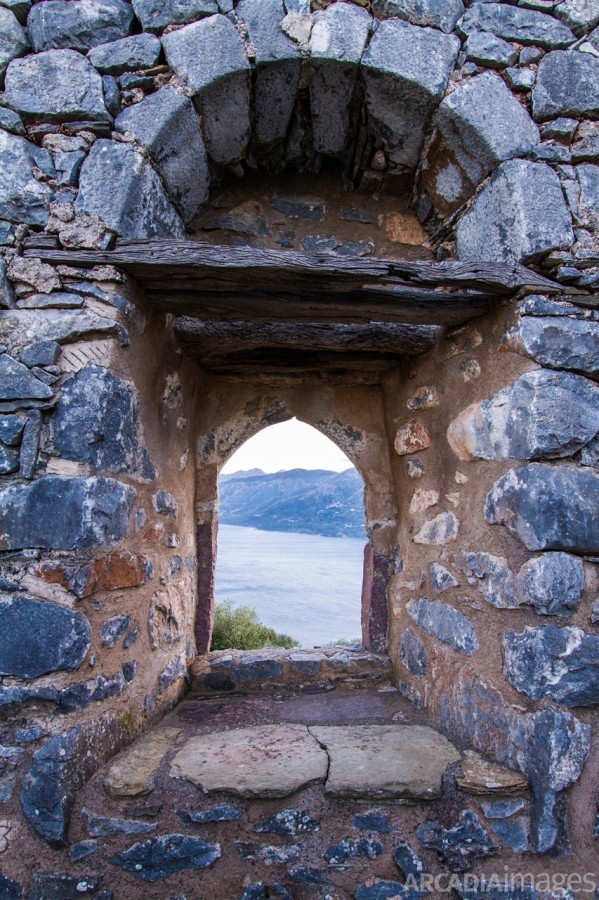 A window in the wall of Sotiros Monastery looking to Laconian Bay