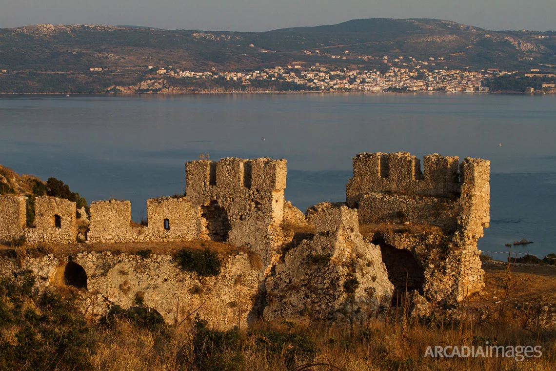 Paleokastro Castle built in 1278 by the Franks and Pylos town in the background. Navarino Bay, Messenia, Peloponnese