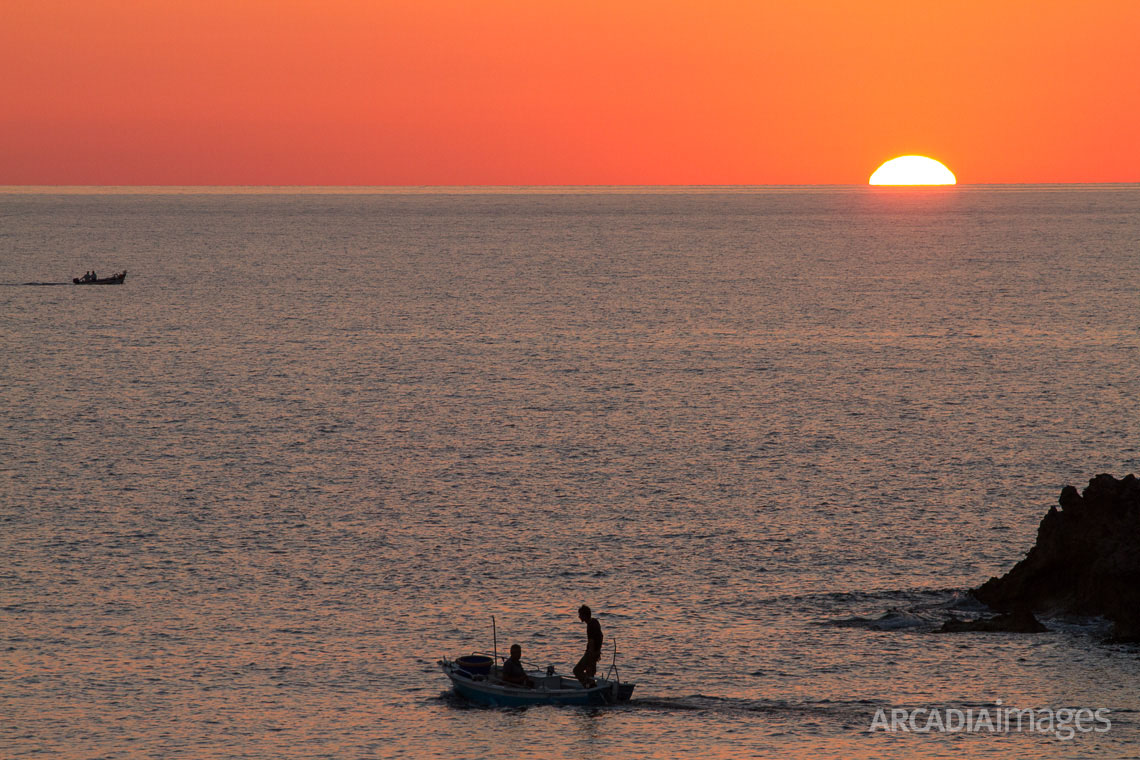 Fishermen at Vromoneri during sunset. Messenia, Peloponnese, Greece